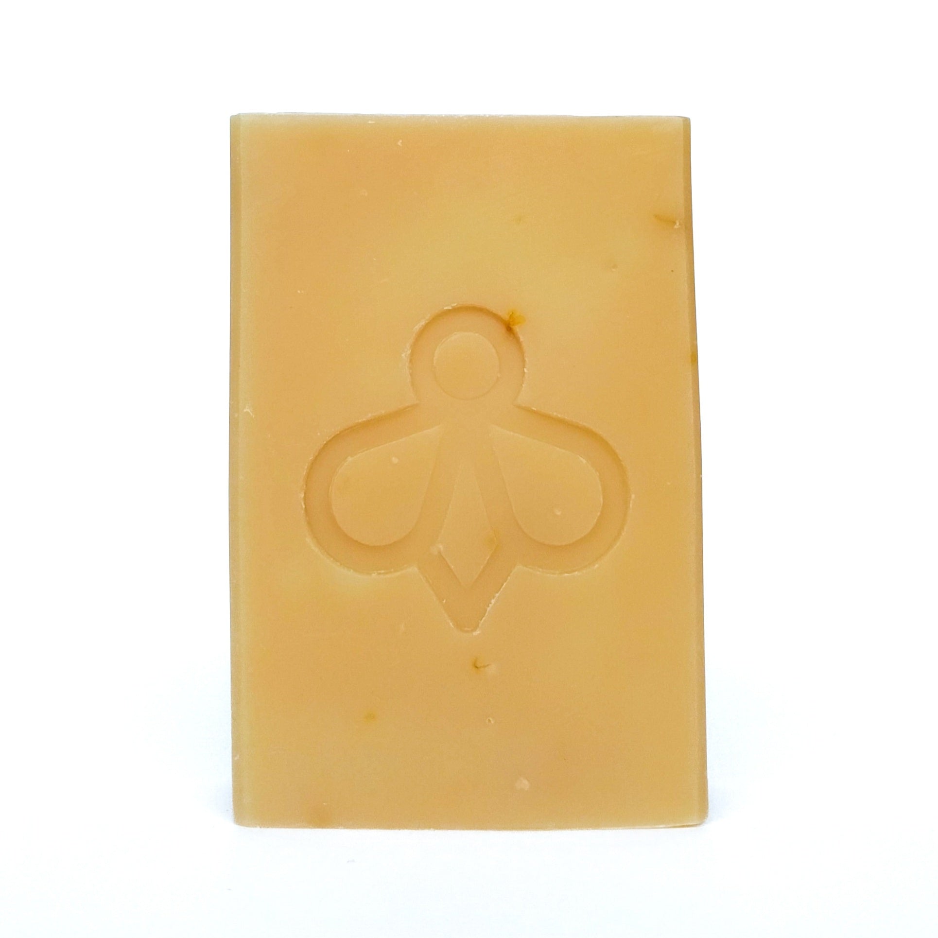 Sunshine soap, with Yellow Clay and Calendula Petals on White Background - Our soap features a soft, natural colour from yellow clay and is adorned with speckles of calendula petals, all showcased against a clean white background.