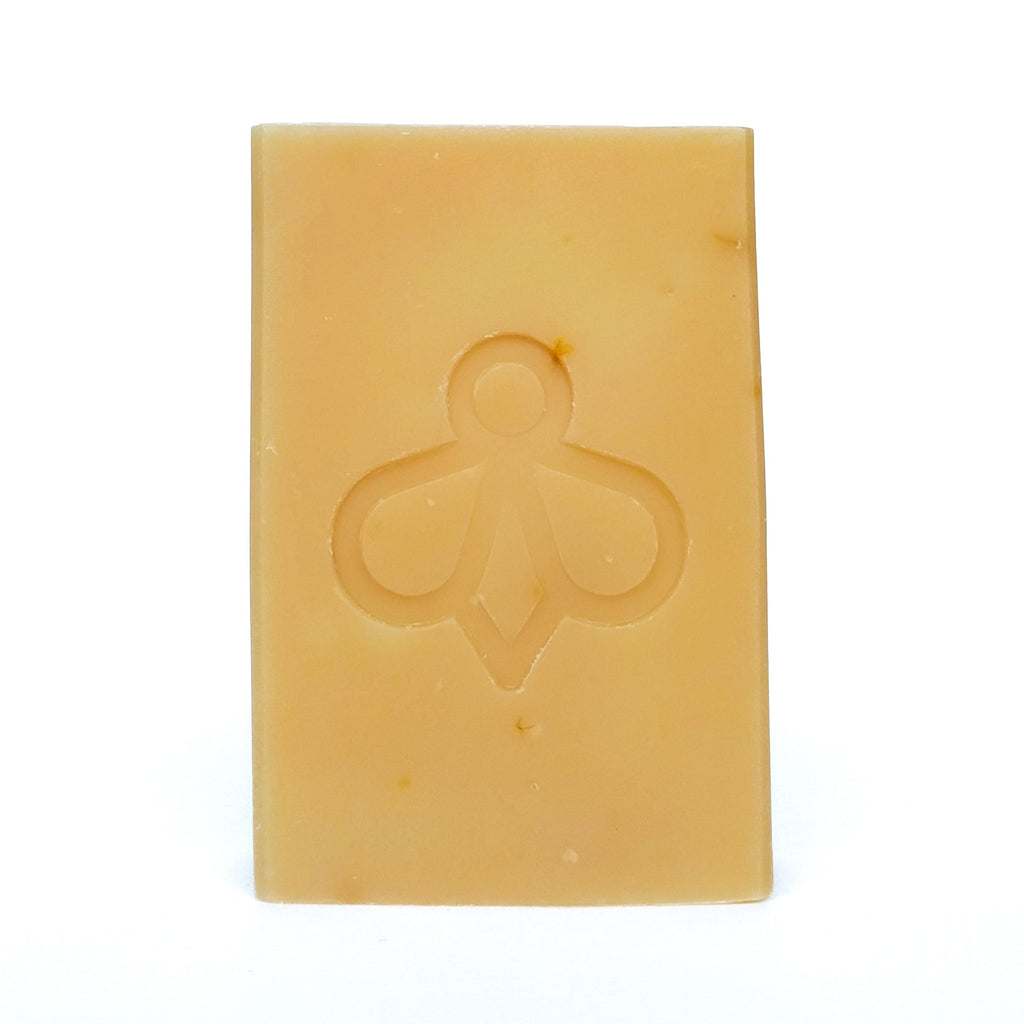Sunshine soap, with Yellow Clay and Calendula Petals on White Background - Our soap features a soft, natural colour from yellow clay and is adorned with speckles of calendula petals, all showcased against a clean white background.